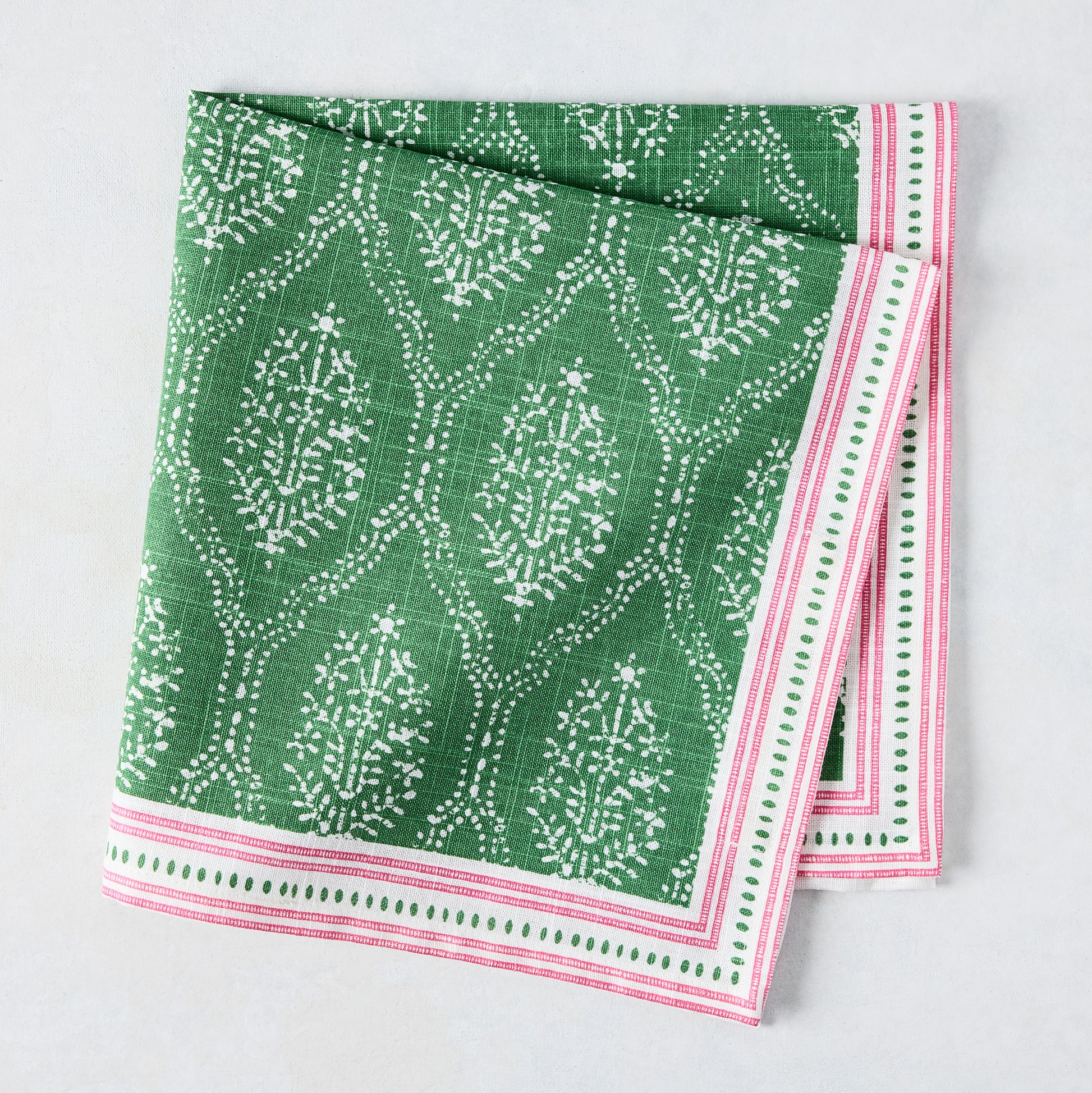 Peter Dunham + Hudson Grace Green Jaali Printed Napkin, 100% cotton slub with pink striped border.