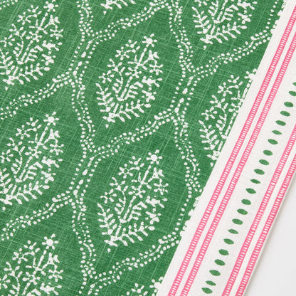 Green cotton slub table runner with white Jaali floral block print and pink striped border.