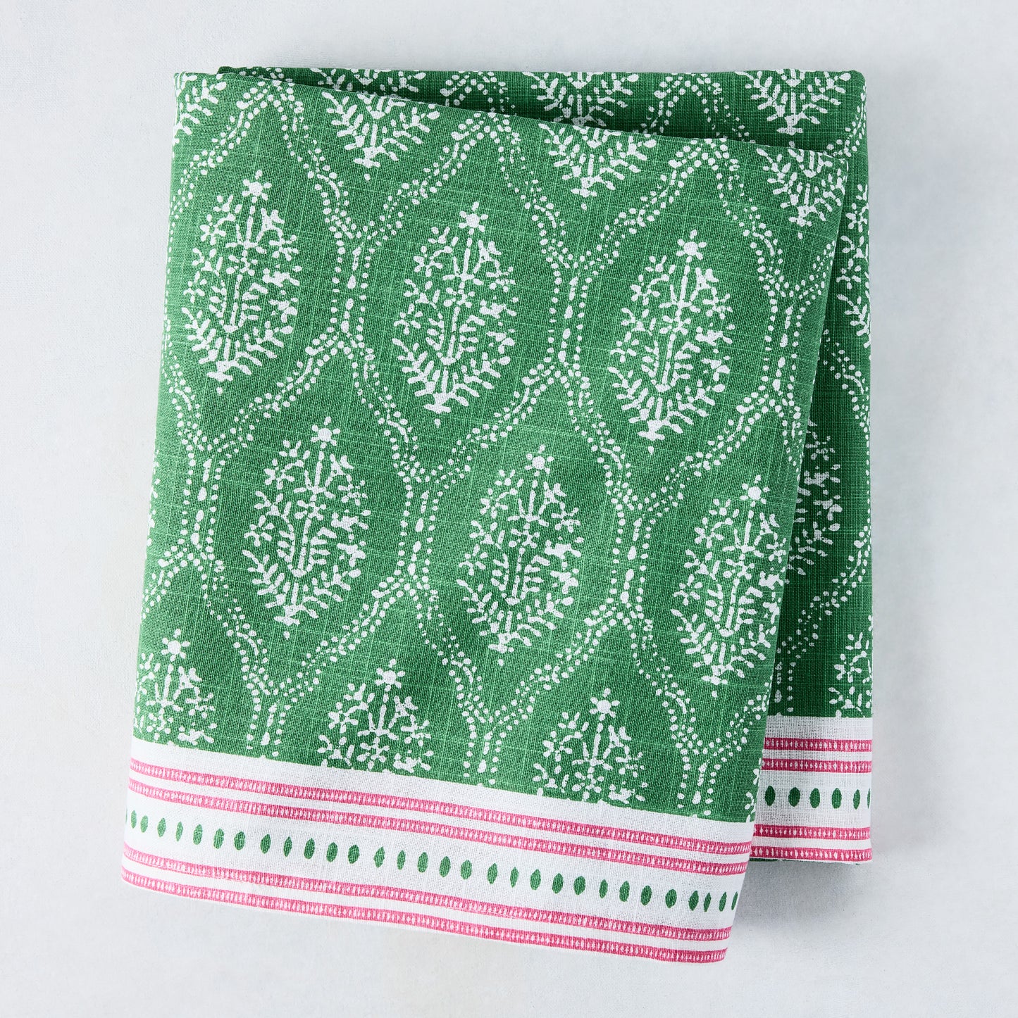 Green Jaali printed cotton slub tablecloth by Peter Dunham + Hudson Grace, with pink border.