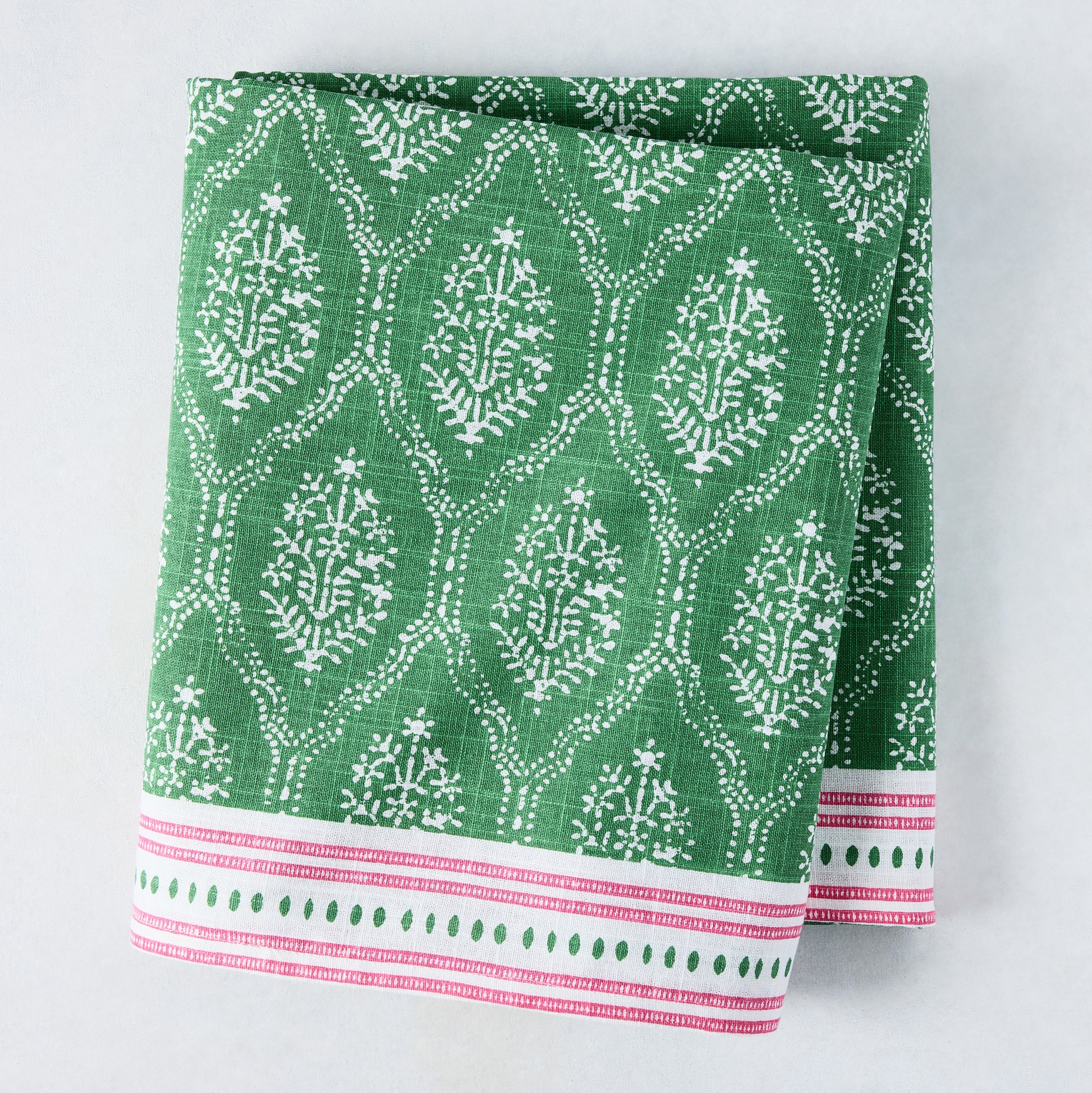 Green Jaali printed cotton slub tablecloth by Peter Dunham + Hudson Grace, with pink border.
