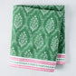 Green Jaali printed cotton slub tablecloth by Peter Dunham + Hudson Grace, with pink border.