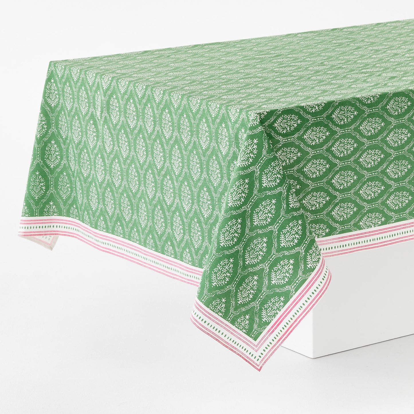 Green cotton slub rectangular tablecloth with white Jaali floral print and a pink decorative border.