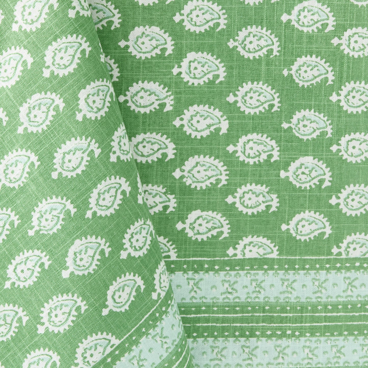 Green cotton slub tablecloth with white paisley print and graphic border from the Peter Dunham + Hudson Grace collection.
