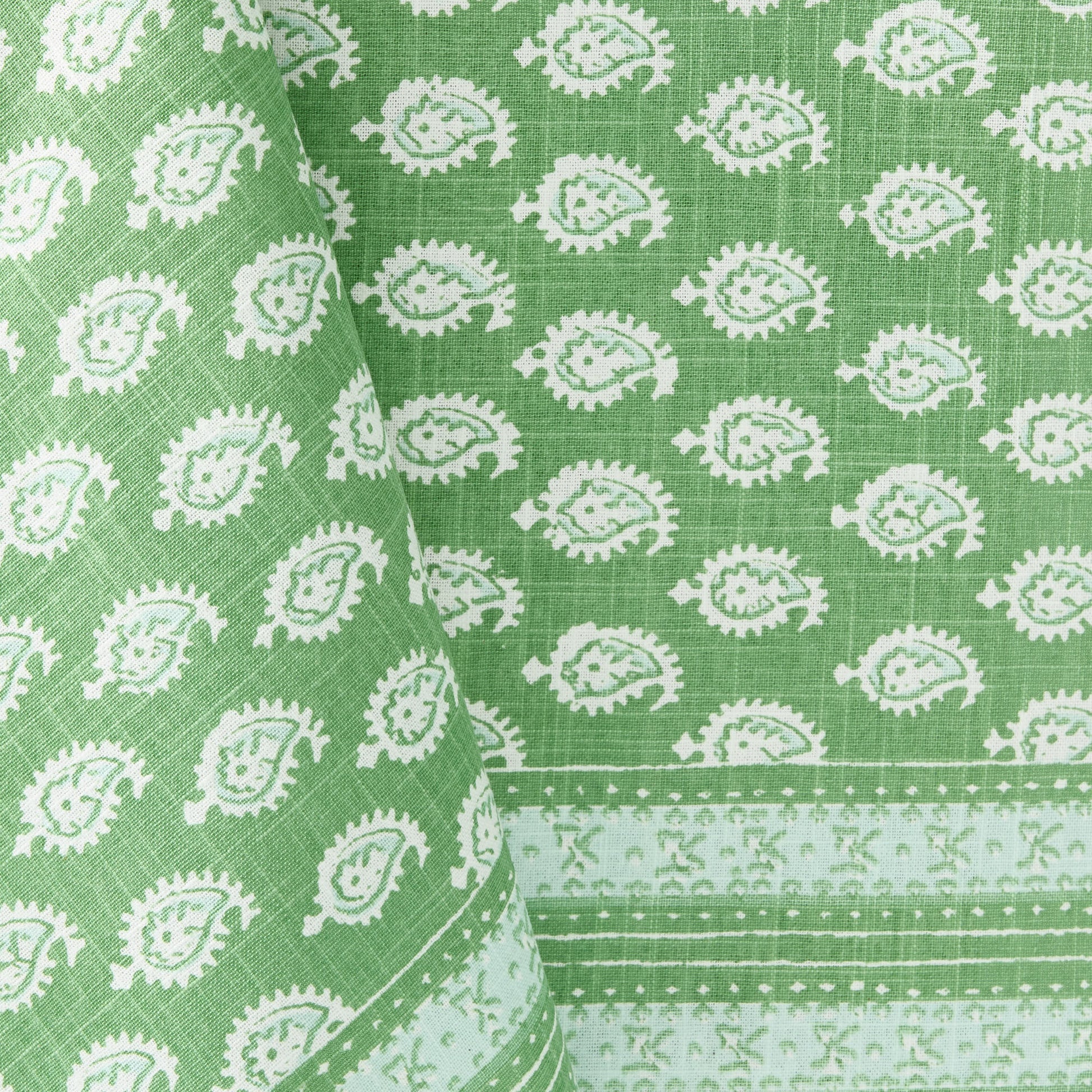 Green cotton slub tablecloth with white paisley print and graphic border from the Peter Dunham + Hudson Grace collection.