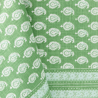 Green cotton slub tablecloth with white paisley print and graphic border from the Peter Dunham + Hudson Grace collection.