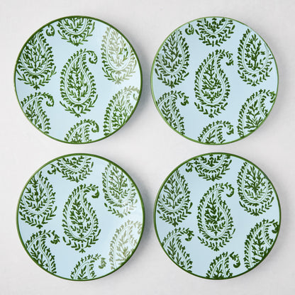 Four Peter Dunham + Hudson Grace Green Kashmir hand-painted paisley salad plates on a light blue background.