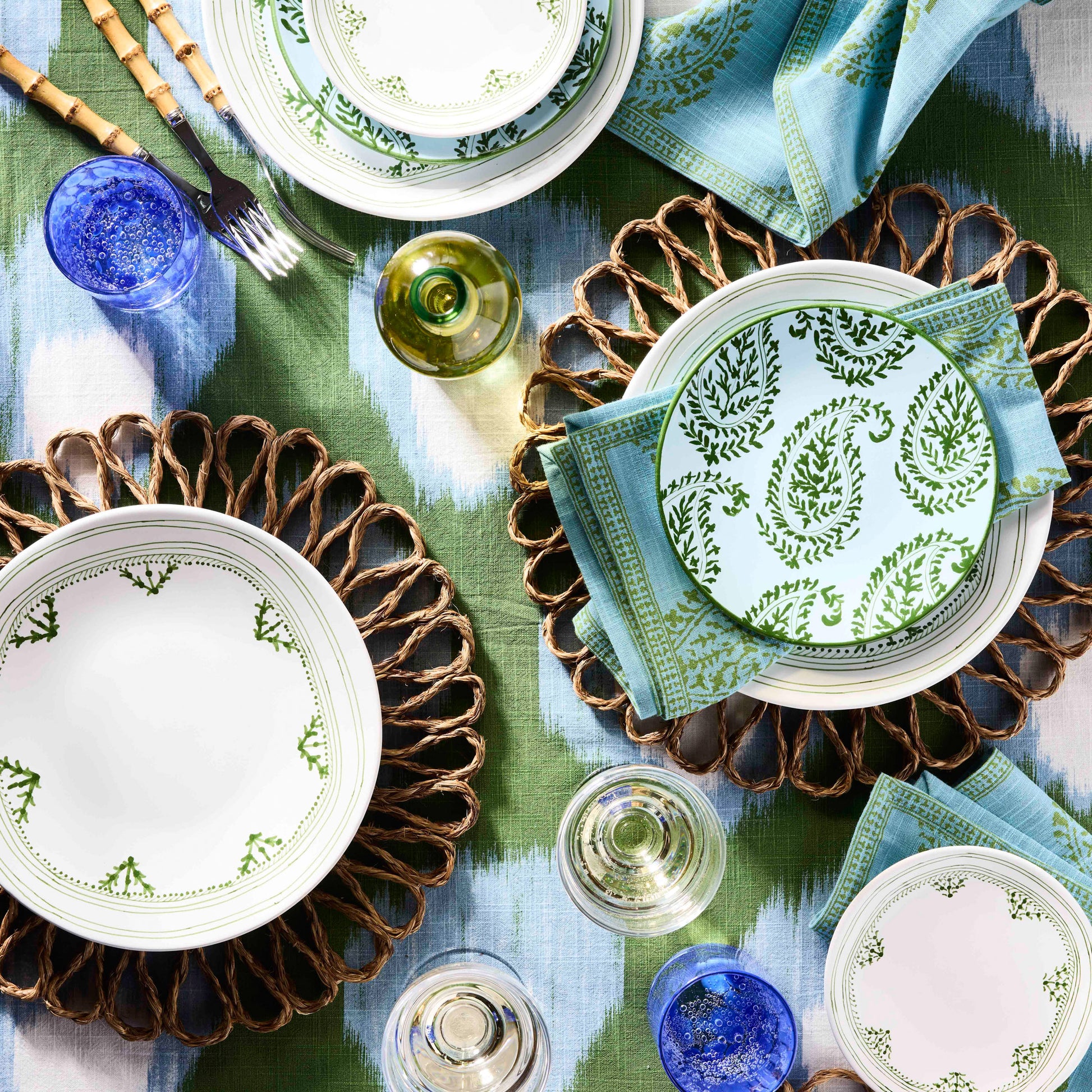 Peter Dunham + Hudson Grace Green Kashmir Paisley printed napkin on a table setting.