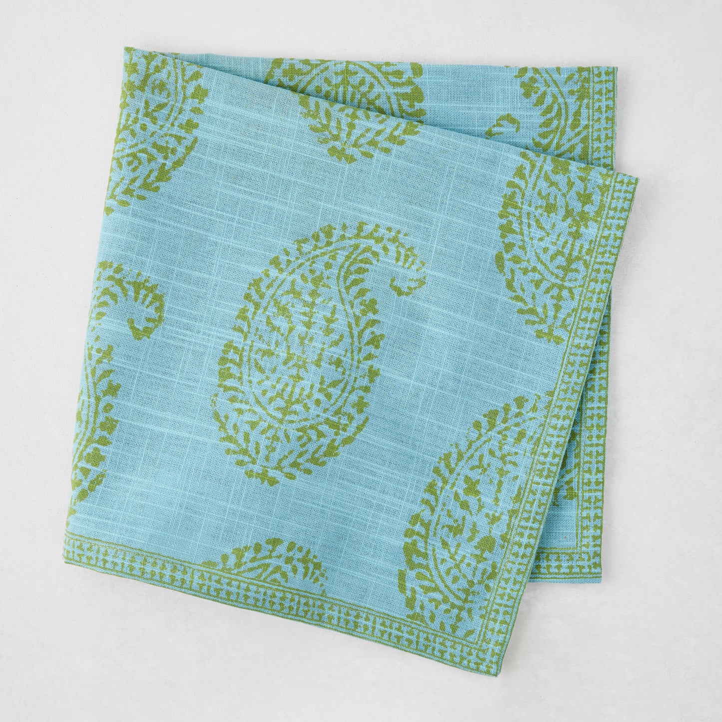 Peter Dunham + Hudson Grace Green Kashmir Paisley Printed Napkin, blue with green paisley pattern.