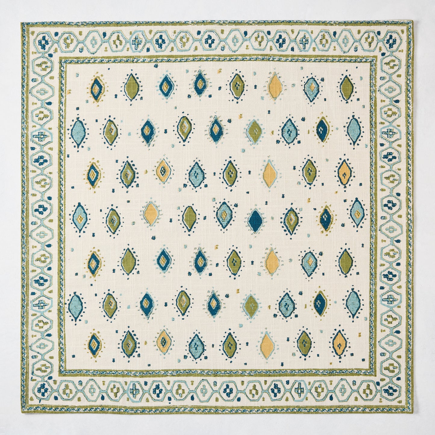 Peter Dunham + Hudson Grace Green Oona Printed Napkin: ivory cotton slub with tribal green and blue pattern.