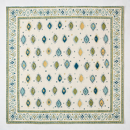 Peter Dunham + Hudson Grace Green Oona Printed Napkin: ivory cotton slub with tribal green and blue pattern.