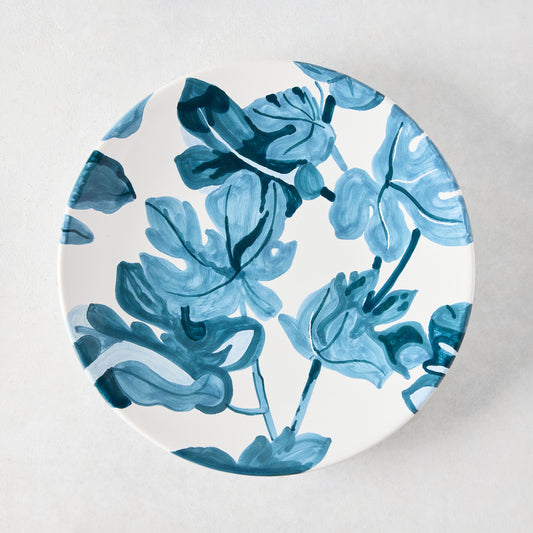 Peter Dunham + Hudson Grace hand-painted blue fig leaf pattern on a white ceramic salad plate.