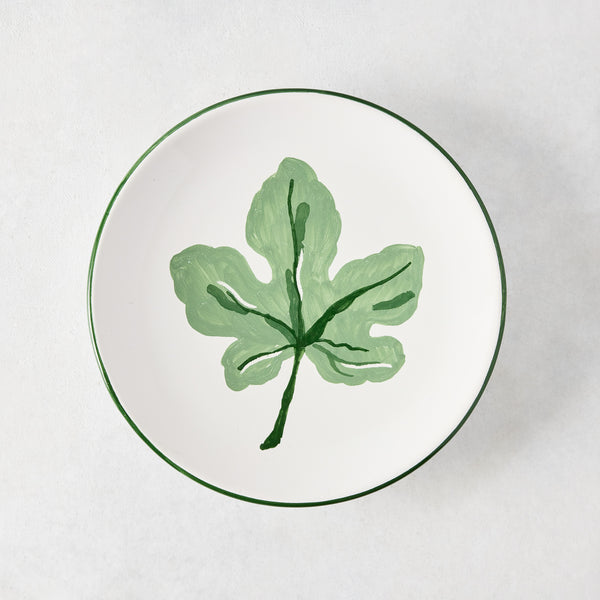 Peter Dunham + Hudson Grace hand-painted white appetizer plate with a green fig leaf and green border.