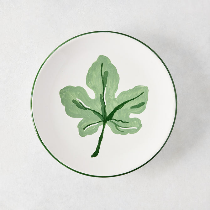 Peter Dunham + Hudson Grace hand-painted white appetizer plate with a green fig leaf and green border.