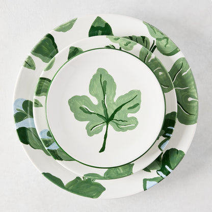 Peter Dunham + Hudson Grace hand-painted white ceramic dinner and salad plates with green fig leaf pattern.