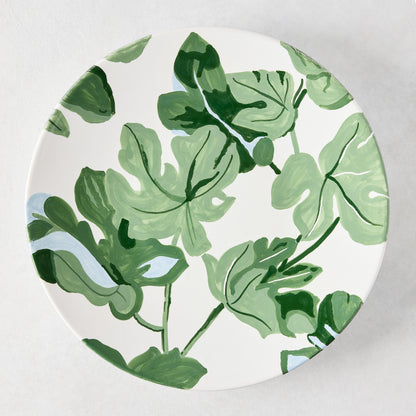 Peter Dunham + Hudson Grace hand-painted white ceramic dinner plate with green fig leaf pattern.