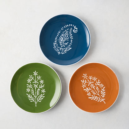 Peter Dunham + Hudson Grace hand-painted Jaali appetizer plates in blue, green, and orange with white floral patterns.