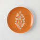 Peter Dunham + Hudson Grace Jaali Spice Orange Appetizer Plate with white hand-painted floral pattern.