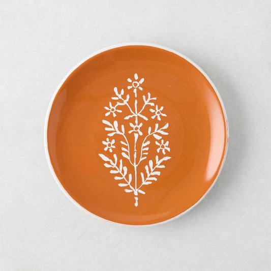 Peter Dunham + Hudson Grace Jaali Spice Orange Appetizer Plate with white hand-painted floral pattern.