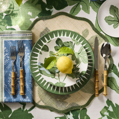 Peter Dunham + Hudson Grace hand-painted leaf green sunburst dinner plate with ikat-inspired blurred edge design.