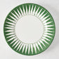 Peter Dunham + Hudson Grace hand-painted dark green sunburst dinner plate with white center.