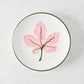 Peter Dunham + Hudson Grace hand-painted white appetizer plate with pink fig leaf and green border.