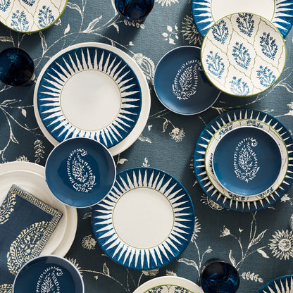 Peter Dunham + Hudson Grace Indigo Blue Hand-Painted Sunburst Dinner Plate, ceramic, with ikat stripe pattern.