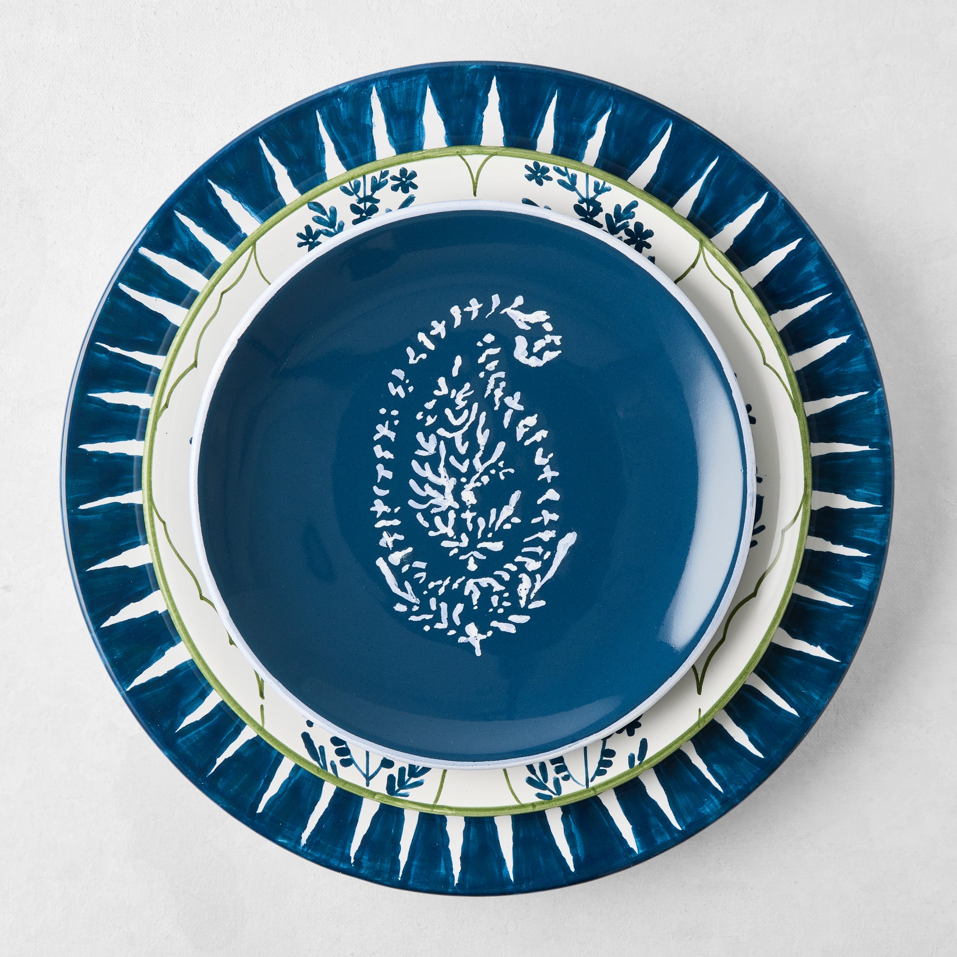 Peter Dunham + Hudson Grace Indigo Blue Hand-Painted Sunburst Dinner Plate, ikat stripe inspired design.