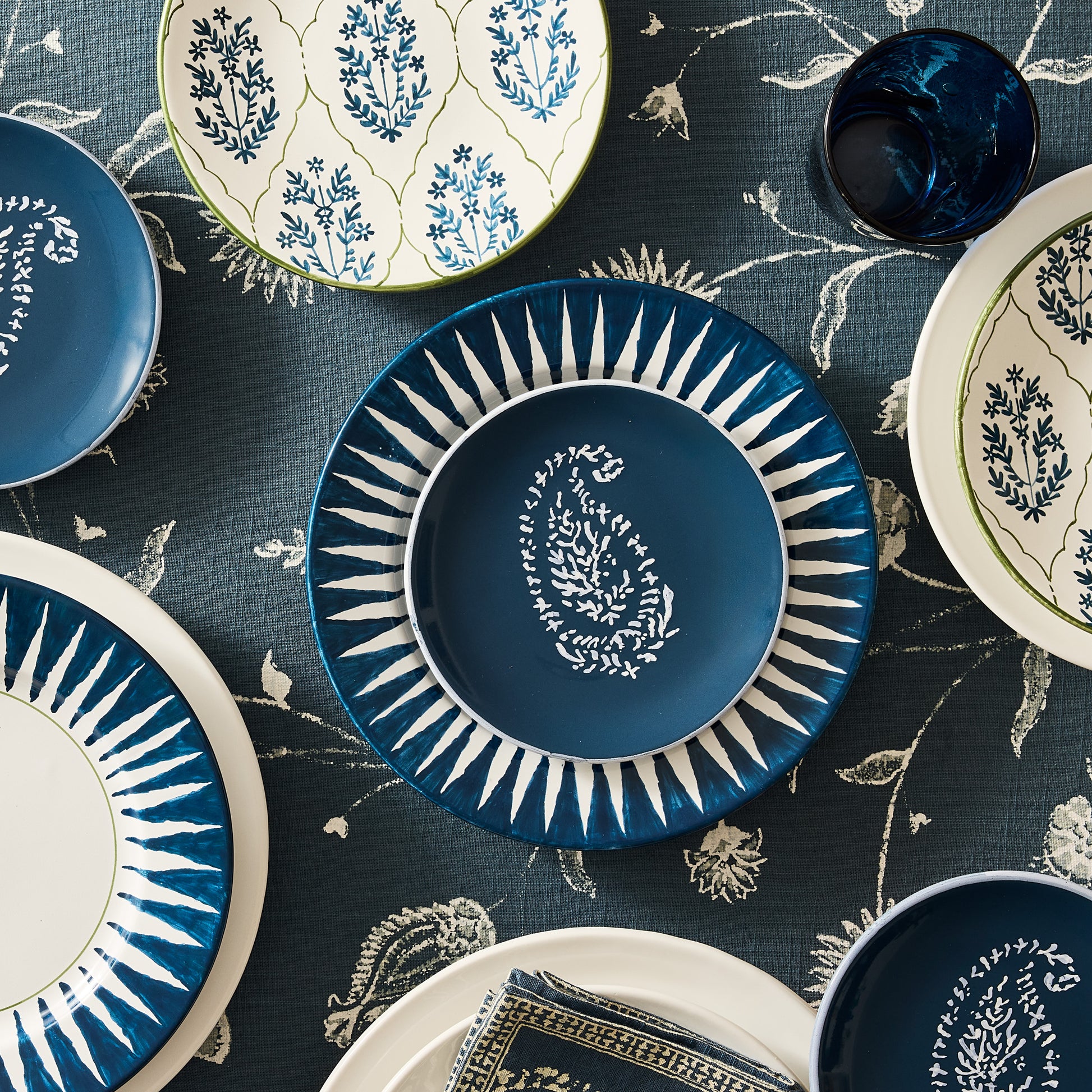 Peter Dunham + Hudson Grace Indigo Blue Hand-Painted Sunburst Dinner Plate with ikat stripe design.