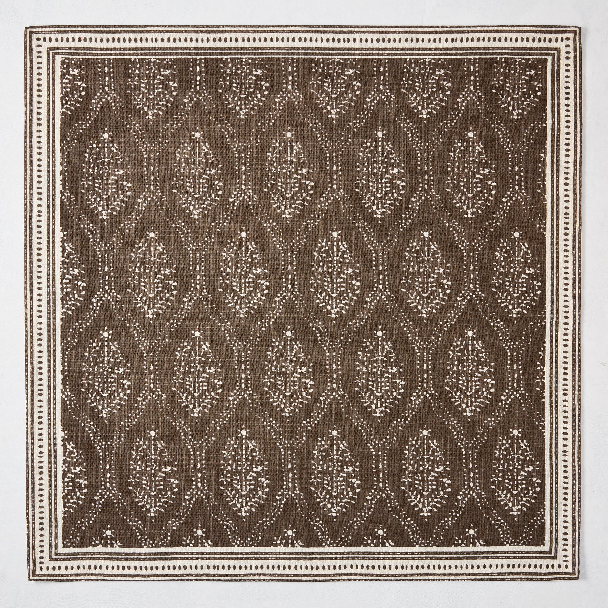 Peter Dunham + Hudson Grace Jaali Chocolate Brown Printed Napkin, 100% cotton slub with floral pattern and border.