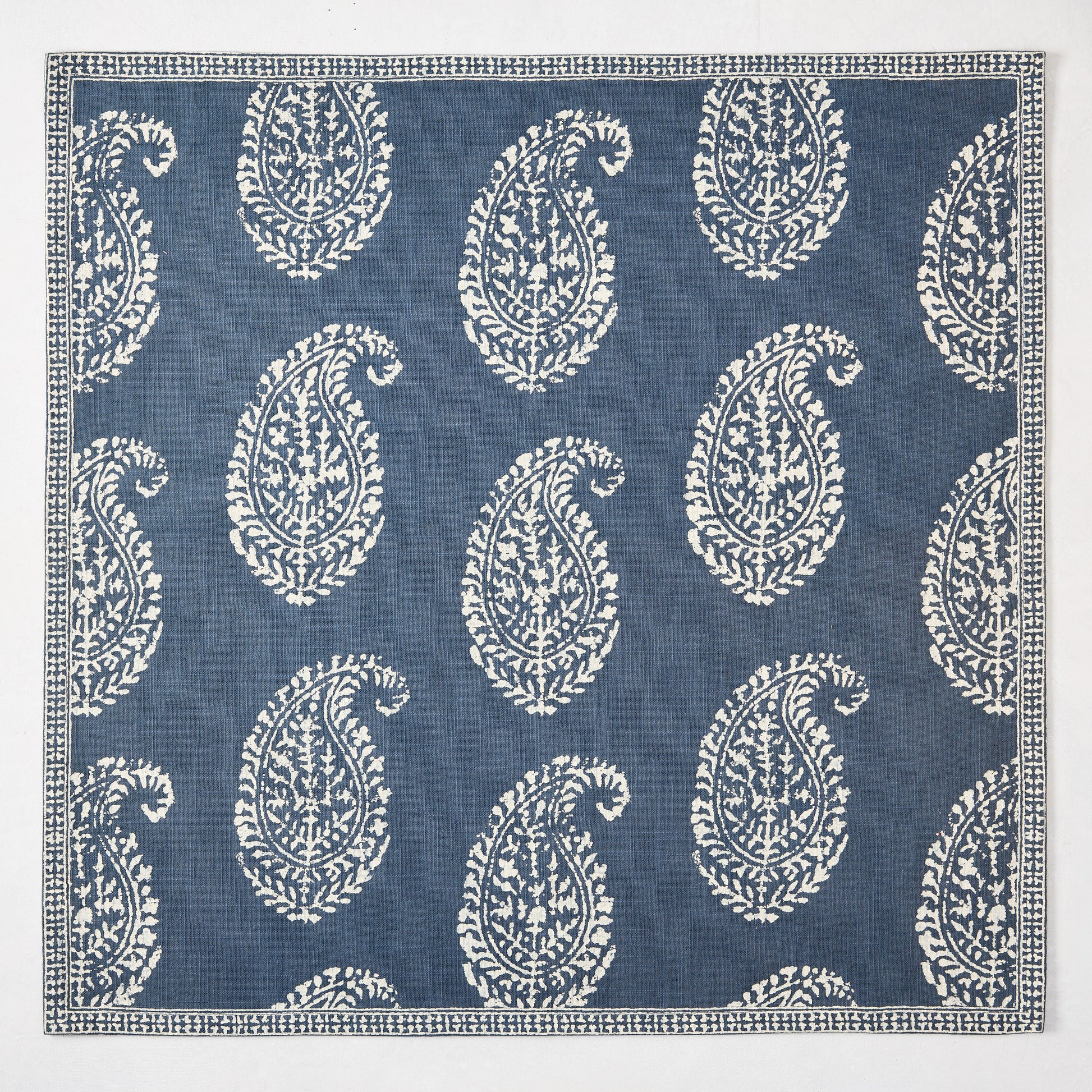 Peter Dunham + Hudson Grace Kashmir Paisley Indigo Blue Printed Napkin with white motif.