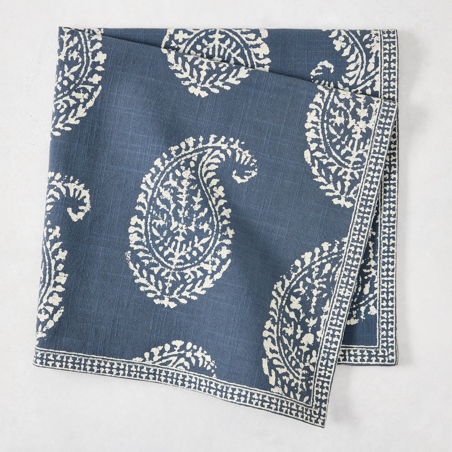 Peter Dunham + Hudson Grace Kashmir Paisley Indigo Blue Printed Napkin, folded.