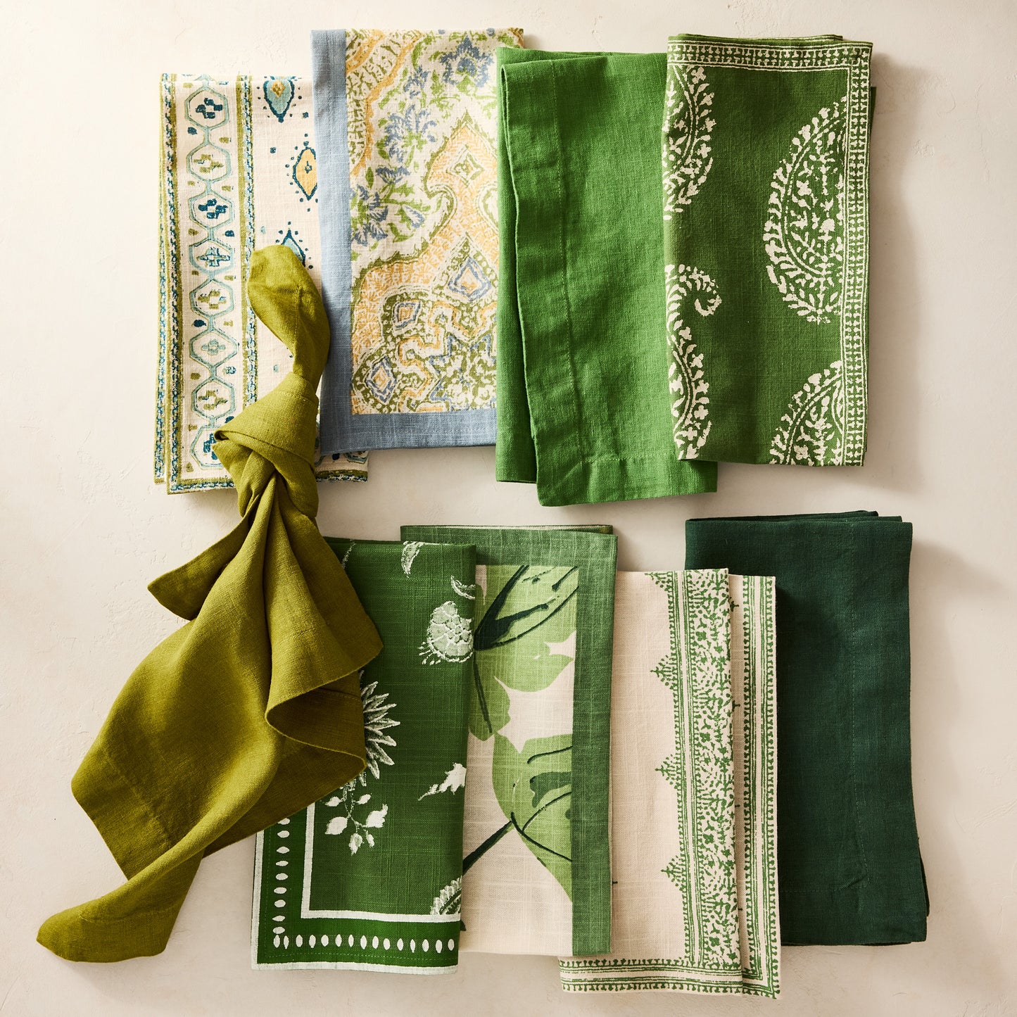 Peter Dunham + Hudson Grace Natural Fig Leaf Printed Napkin with green border, 100% cotton slub.