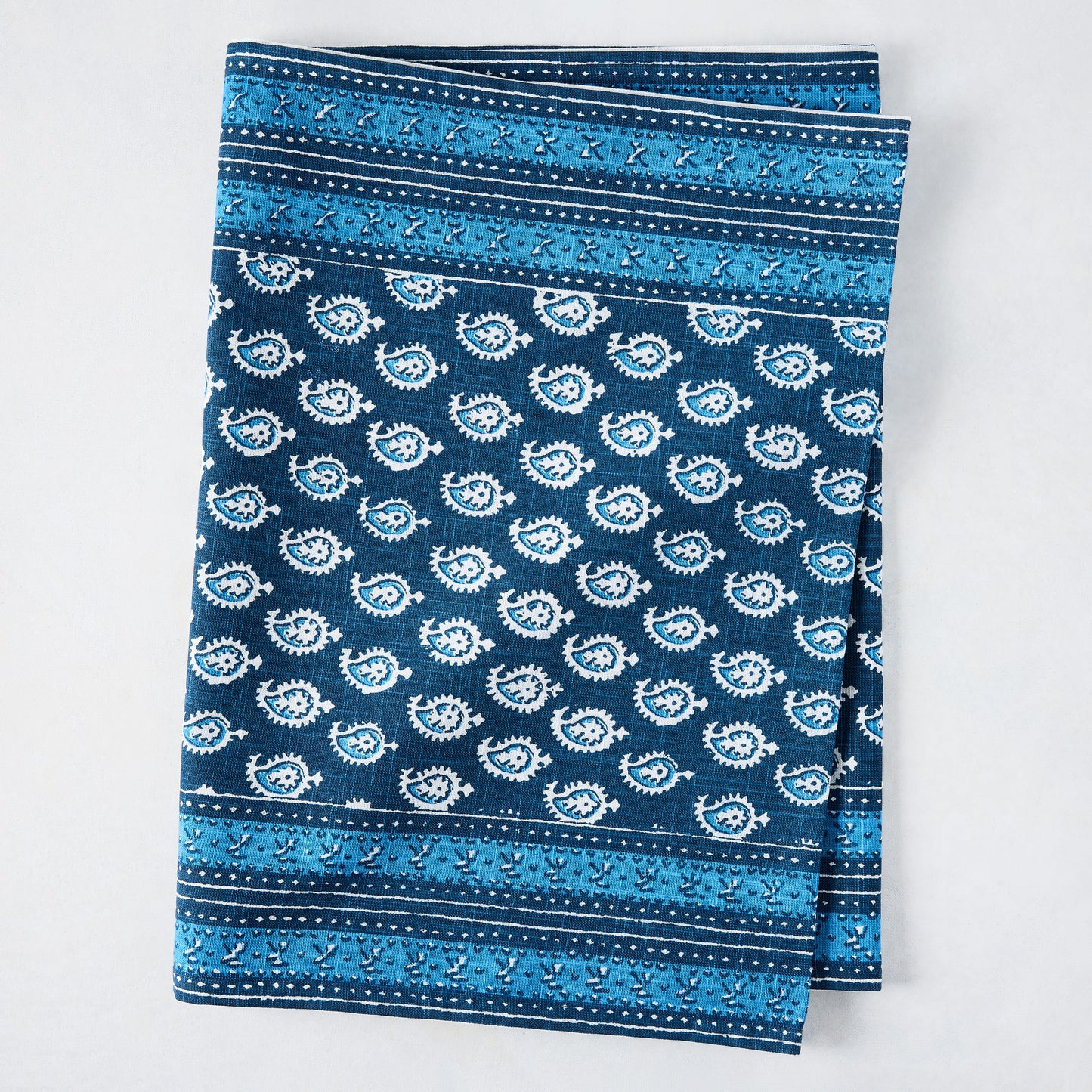 Navy blue Janpath printed cotton slub table runner with white paisley and graphic border.