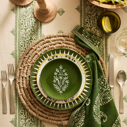 Peter Dunham + Hudson Grace Olive Green Hand-Painted Jaali Salad Plate with yellow border on a woven placemat.