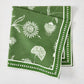 Olive green cotton slub napkin with white Indian chintz floral print and dotted border.