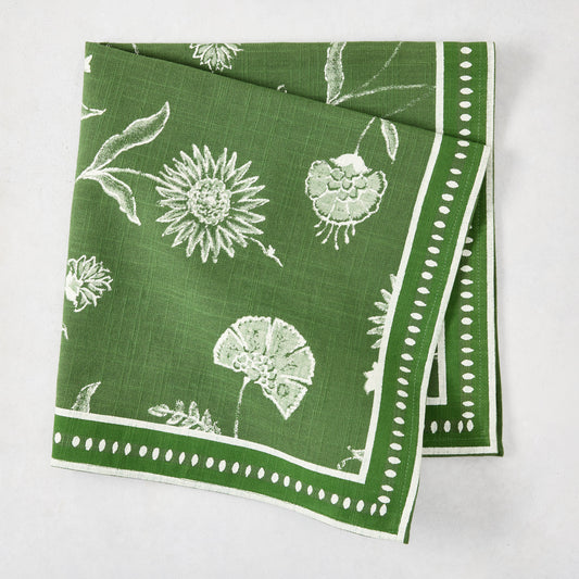 Olive green cotton slub napkin with white Indian chintz floral print and dotted border.