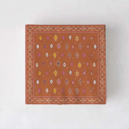 Peter Dunham + Hudson Grace Oona cocktail napkins with tribal motif in orange, pink, and yellow.