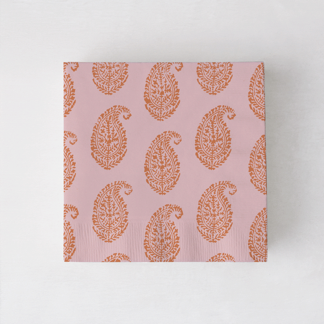 Peter Dunham + Hudson Grace Orange Kashmir cocktail napkins with paisley print.