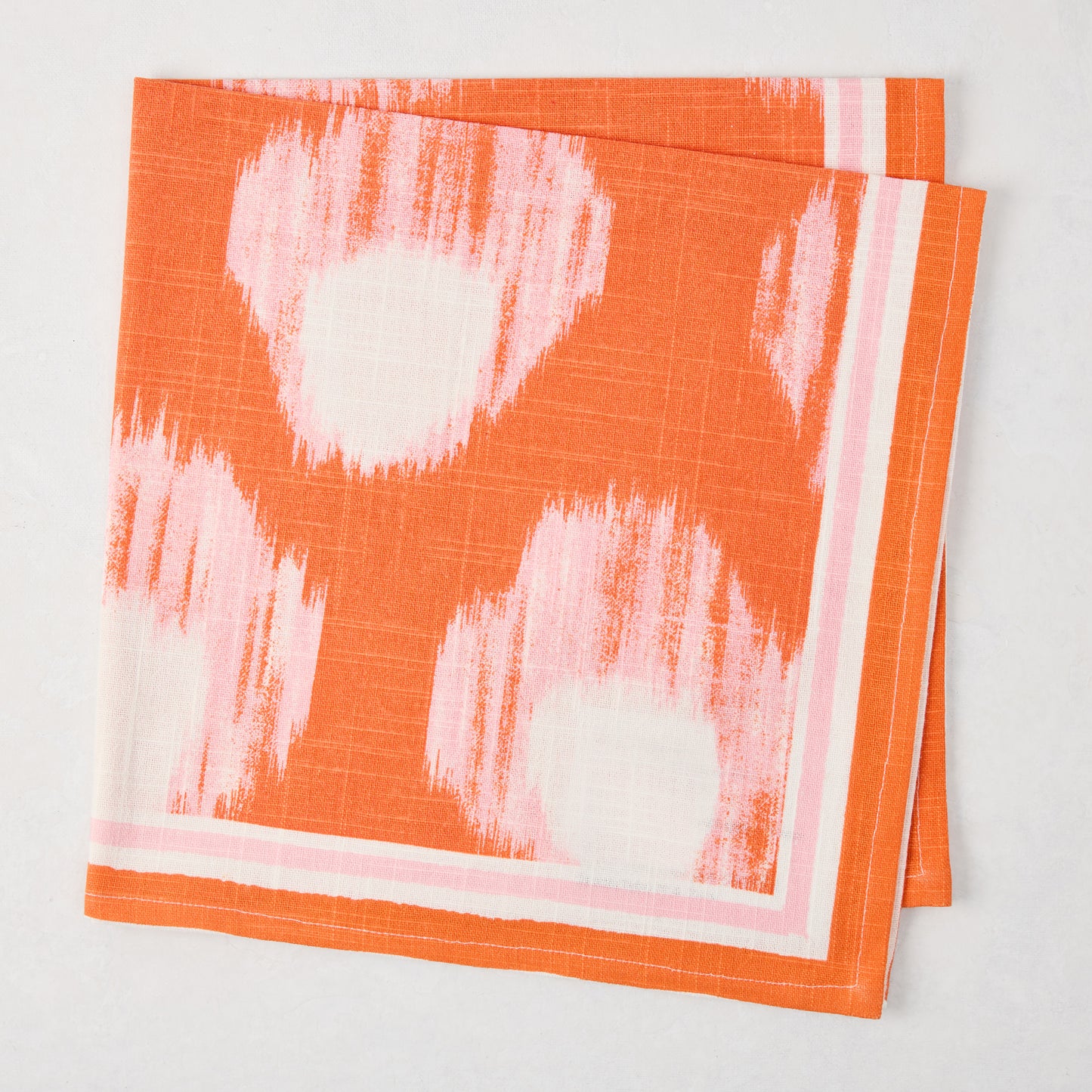 Peter Dunham + Hudson Grace Orange Bukhara Ikat Printed Napkin, 100% cotton slub with pink and white border.