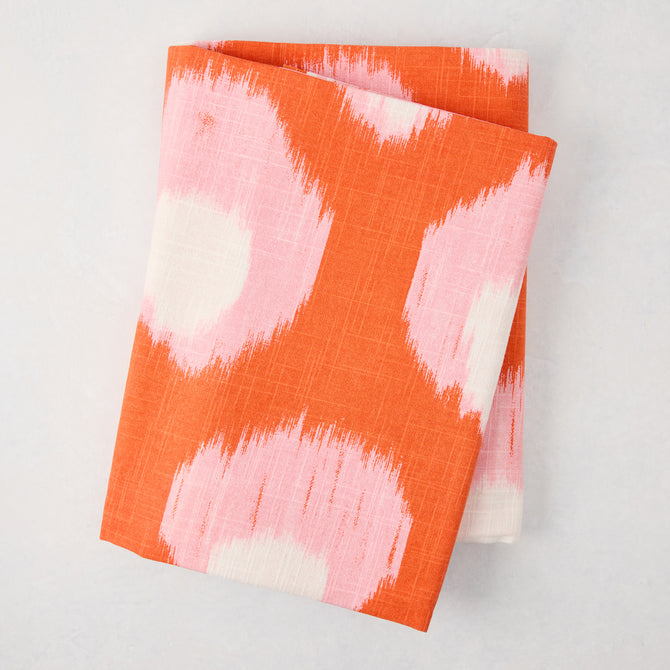 Peter Dunham + Hudson Grace Orange Bukhara Ikat Printed Tablecloth, 100% cotton slub, folded.