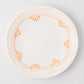 Peter Dunham + Hudson Grace Orange Fez hand-painted border dinner plate, white with orange pattern.