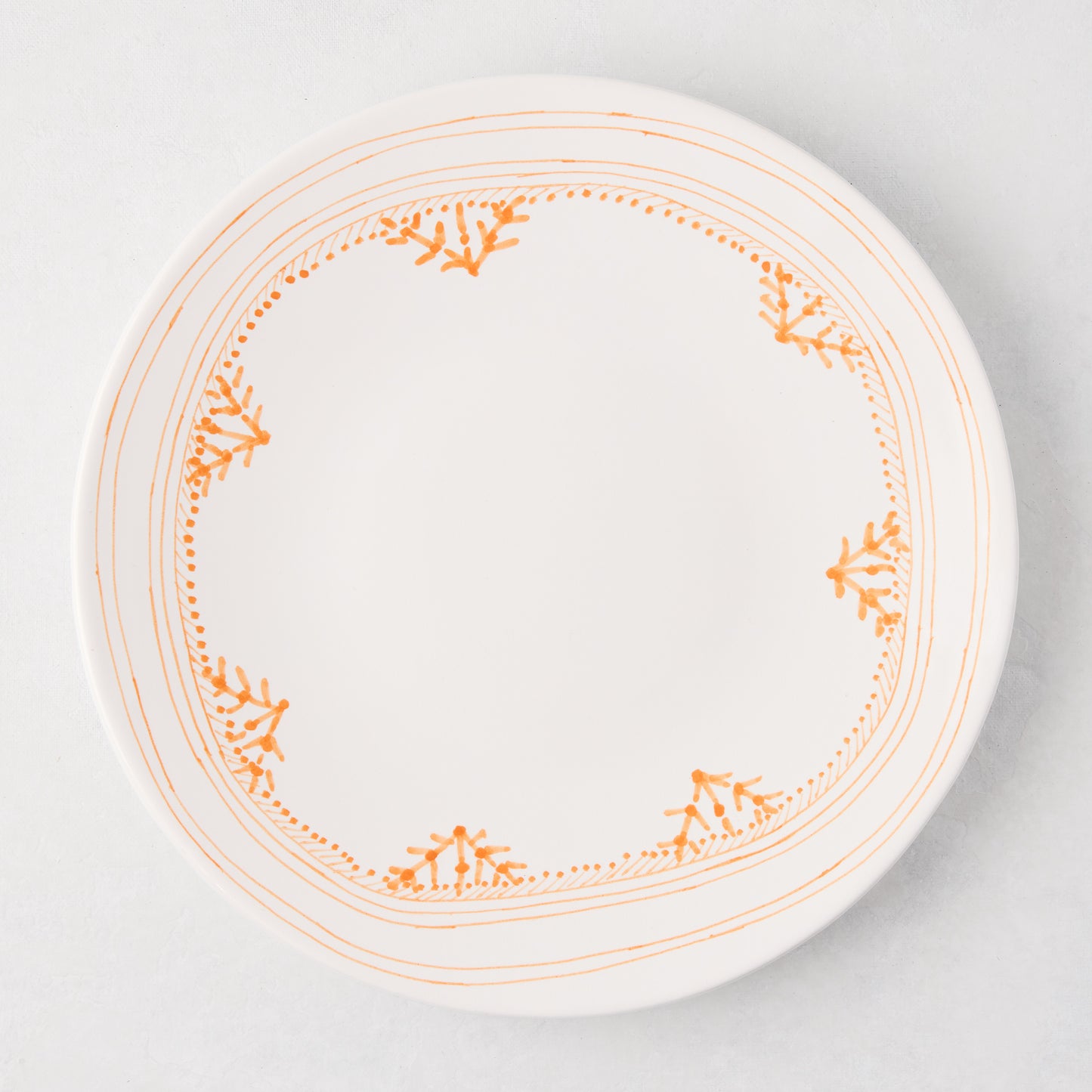 Peter Dunham + Hudson Grace Orange Fez hand-painted border dinner plate, white with orange pattern.