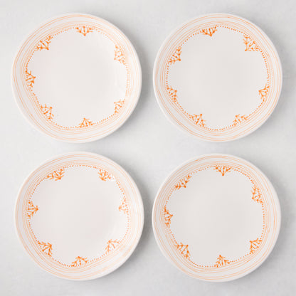 Four white Peter Dunham + Hudson Grace Orange Fez hand-painted salad plates with an orange border pattern.