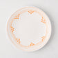 Peter Dunham + Hudson Grace Orange Fez hand-painted salad plate with an orange patterned border.