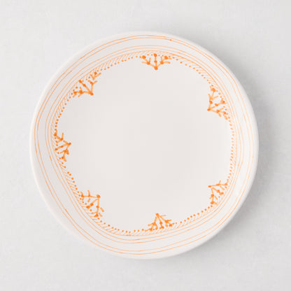 Peter Dunham + Hudson Grace Orange Fez hand-painted salad plate with an orange patterned border.