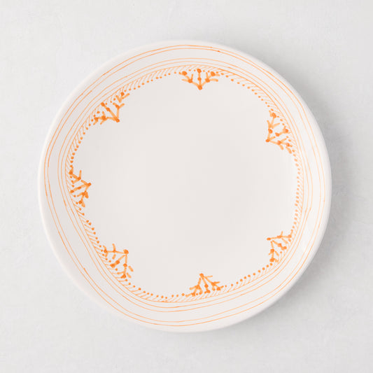 Peter Dunham + Hudson Grace Orange Fez hand-painted salad plate with an orange patterned border.