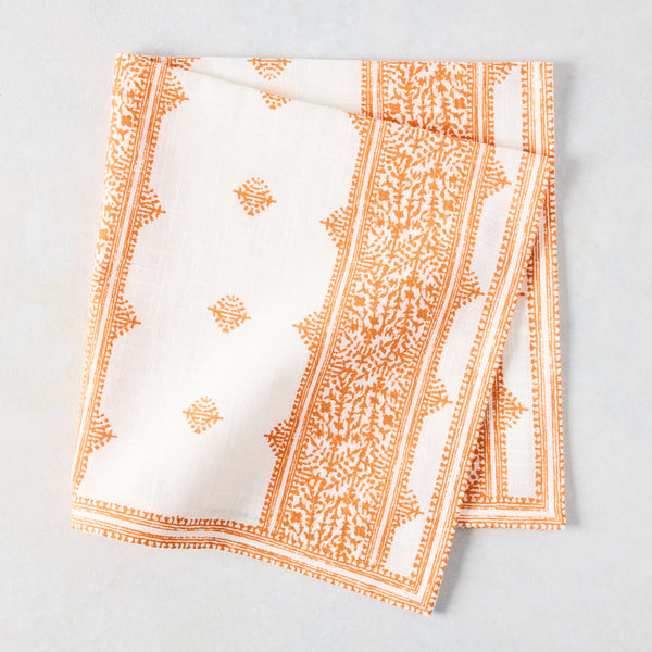 Peter Dunham + Hudson Grace Orange Fez Stripe printed cotton slub napkin, folded on a light surface.