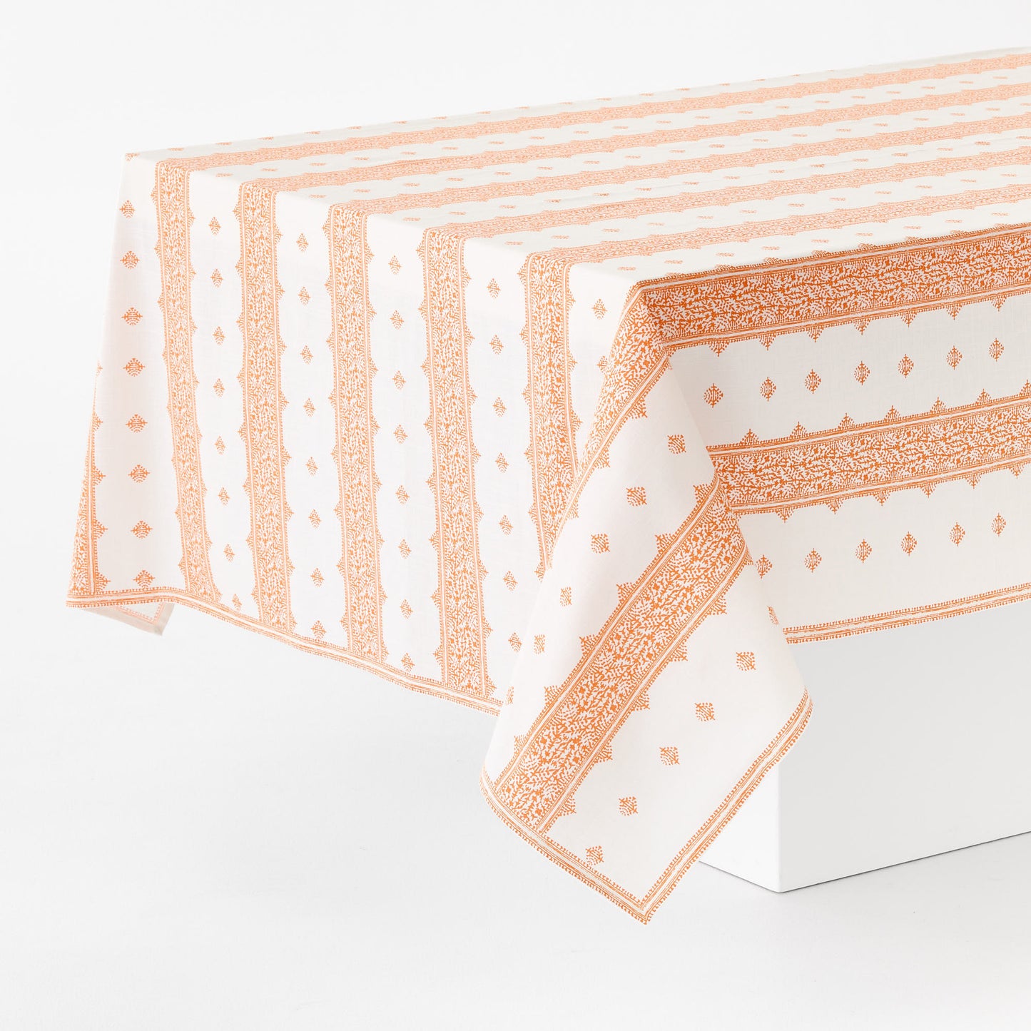 Peter Dunham + Hudson Grace rectangular cotton tablecloth in orange Fez stripe print on white background.