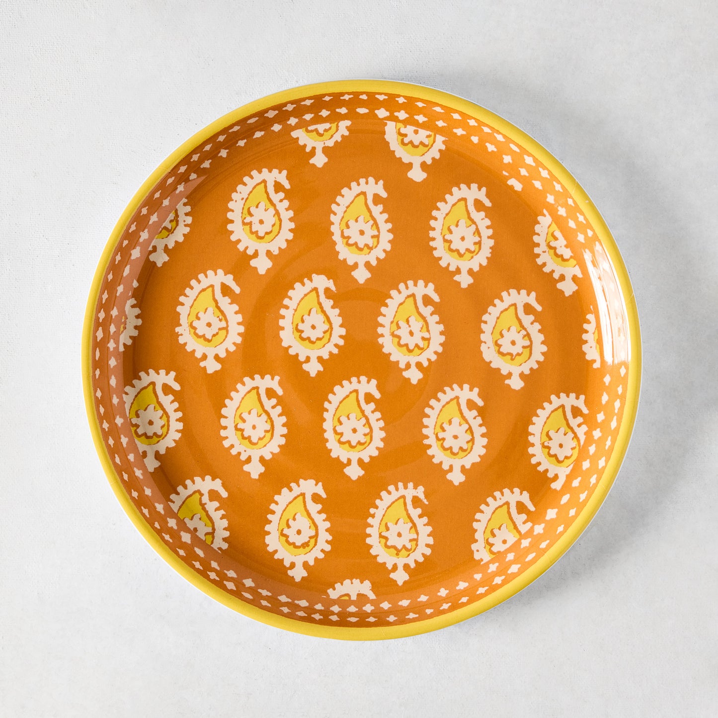 Peter Dunham + Hudson Grace Orange Janpath Melamine Salad Plate with paisley pattern and graphic border.