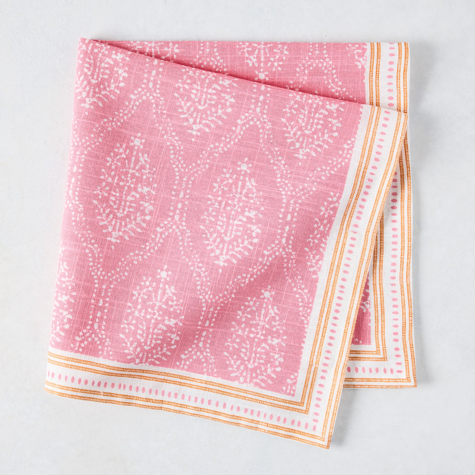 Peter Dunham + Hudson Grace Pink Jaali Printed Napkin, 100% cotton slub with orange border.